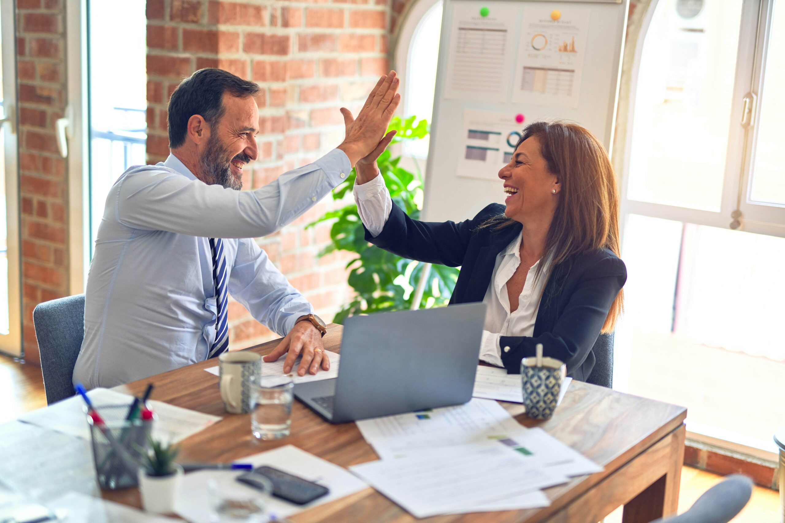 Colleagues giving high-fives.